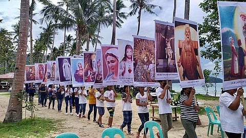 Procession of the faithful bearing banners of the Lord Jesus Christ and Mother Mary. | PHOTOGRAPHS COURTESY OF BABY NEBRIDA
