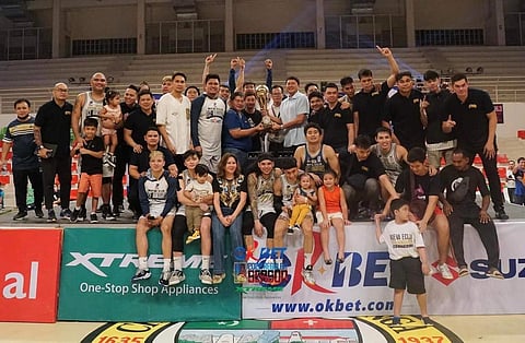 PHOTOGRAPH COURTESY OF MPBL
MPBL commissioner Kenneth Duremdes hands the P14-million trophy to Nueva Ecija team owner Bong Cuevas following their 69-56 win over Zamboanga in Game 4 of their OKBet-MPBL 4th Season best-of-five finals series.