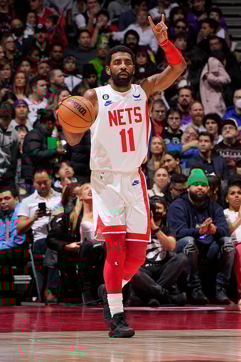 Kyrie Irving and the Brooklyn Nets notch their fifth straight win by edging the Toronto Raptors, 119-116. | ANDREW LAHODYNSKYJ/AGENCE FRANCE-PRESSE