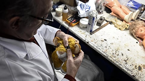"We are the only ones working on every type of toy" in Spain, said Antonio Martinez Rivas, a Madrid native who learnt from his father how to repair toys. The 70-year-old toy specialist will retire on 31 December. (Photo by OSCAR DEL POZO / AFP)