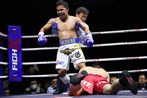 PHOTOGRAPH COURTESY
OF TEAM PACQUIAO
MANNY Pacquiao knocks down Korean mixed martial arts specialist DK Yoo during their exhibition match Sunday at the KINTEX in Goyang, South Korea.