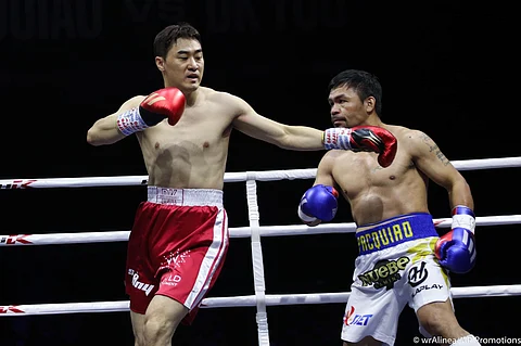 Manny Pacquiao sends DK Yoo running for his life in their exhibition match recently in Goyang, Korea. | Photograph COURTESY OF TEam Pacquiao