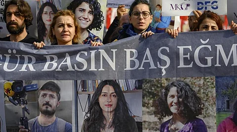 Since 2014, when Erdogan became president, tens of thousands of people, from high-school teens to a former Miss Turkey, have been prosecuted under a longstanding law that criminalizes insulting the president. (Photo by YASIN AKGUL / AFP)