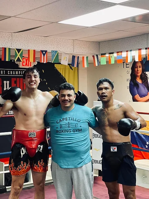 PHOTOGRAPH COURTESY OF Eumir Marcial
Eumir Marcial (right) takes a break during heavy training with Mexican heavyweight sparmate Julian Fernandez and chief trainer Jorge Capetillo in Las Vegas.