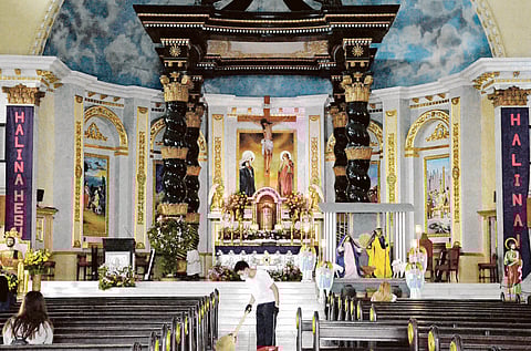 Spruced up The St. Peter Parish Shrine of Leaders in Quezon City gets a last-minute cleanup Thursday on the eve of the nine-day Simbang Gabi starting today across the nation — a legacy of the 400-year rule of the Spaniards. | PHOTOGRAPH BY ANALY LABOR FOR THE DAILY TRIBUNE @tribunephl_ana