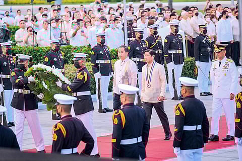 President Ferdinand R. Marcos Jr. leads the wreath-laying ceremony with National Historical Commission of the Philippines chairperson Rene Escalante and Armed Forces of the Philippines chief of staff, Gen. Bartolome Vicente Bacarro, during the commemoration of the 126th anniversary of the martyrdom of Dr. Jose Rizal at the latter’s monument in Rizal Park, Manila on Friday, 30 December 2022. | PHOTOGRAPH BY YUMMIE DINGDING FOR THE DAILY TRIBUNE @tribunephl_yumi