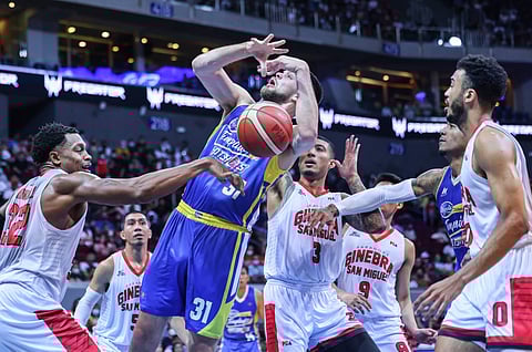 Justin Brownlee strips the ball from Magnolia import Nick Rakocevic in the semifinal match between Barangay Ginebra San Miguel and Magnolia in the PBA Commissioner's Cup on Wednesday, 21 December. Photo by Rio Deluvio