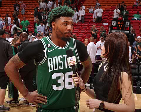 Marcus Smart #36 of the Boston Celtics talks to the media after the game during round 3 game 4 of the Eastern Conference Finals 2023 NBA Playoffs on 19 May 2023 at the Kaseya Center Arena in Miami, Florida.