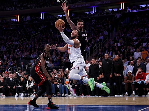 Jalen Brunson of the New York Knicks heads for the net as Bam Adebayo and Max Strus of the Miami Heat defend in the fourth quarter during game two of the Eastern Conference Semifinals at Madison Square Garden on May 02, 2023 in New York City. The New York Knicks defeated the Miami Heat 111-105. Photo by ELSA / GETTY IMAGES NORTH AMERICA / Getty Images via AFP