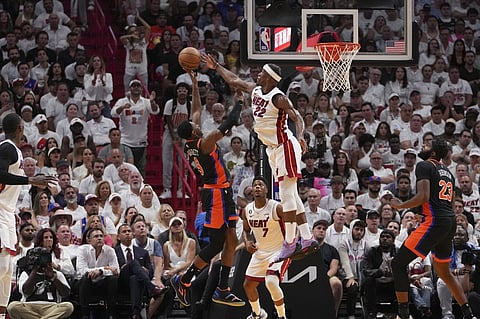 Jimmy Butler #22 of the Miami Heat blocks a shot attempt by RJ Barrett #9 of the New York Knicks during Game Four of the Eastern Conference Semifinals at Kaseya Center on May 08, 2023 in Miami, Florida. The Heat won the game 109-101. Photo by Eric Espada / GETTY IMAGES NORTH AMERICA / Getty Images via AFP