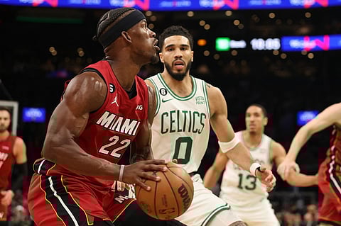 Jimmy Butler #22 of the Miami Heat is defended by Jayson Tatum #0 of the Boston Celtics during the third quarter of game one of the Eastern Conference Finals at TD Garden on 17 May in Boston, Massachusetts. Photo by Adam Glanzman / GETTY IMAGES NORTH AMERICA / Getty Images via AFP