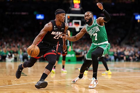 Jimmy Butler #22 of the Miami Heat dribbles against Jaylen Brown #7 of the Boston Celtics during the third quarter in game seven of the Eastern Conference Finals at TD Garden on May 29, 2023 in Boston, Massachusetts. Photo by Maddie Meyer / GETTY IMAGES NORTH AMERICA / Getty Images via AFP
