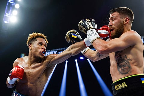 Kudryavtsev/Agence France-Presse | Devin Haney (left) keeps his undisputed world lightweight title by outpointing Vasyl Lomachenko yesterday in their Las Vegas slugfest.