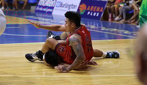 Blackwater's James Sena lands on top of new NLEX player Dominick Fajardo during a loose ball scramble in this piece of action in the PBA On Tour.