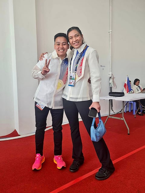 Volleyball star Alyssa Valdez (R) and boxing champ Nesthy Petecio rock Team Philippines' parade uniform.
