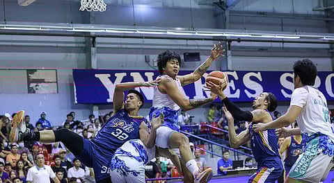 Larry Muyang overpowers Kyle Pascual and Cliff Hodge of Meralco and an unidentified Phoenix Super LPG player during a rebound scramble in this piece of action Sunday night in the PBA On Tour.