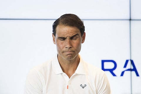 Spanish tennis player Rafael Nadal reacts during a press conference to announce he will not compete in the French Open.