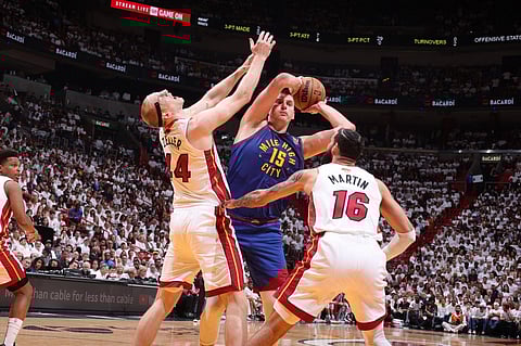 Nikola Jokic #15 of the Denver Nuggets looks to pass the ball during Game Three of the 2023 NBA Finals against the Miami Heat on 7 June at Kaseya Center in Miami, Florida. Photo by Nathaniel S. Butler / NBAE / Getty Images / Getty Images via AFP
