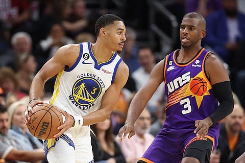 Jordan Poole #3 of the Golden State Warriors handles the ball against Chris Paul #3 of the Phoenix Suns during the second half of the NBA game at Footprint Center on October 25, 2022 in Phoenix, Arizona. Photo by Christian Petersen / GETTY IMAGES NORTH AMERICA / Getty Images via AFP