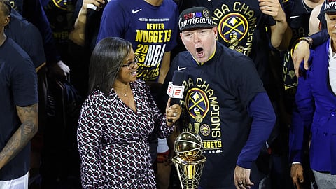 Head coach Michael Malone of the Denver Nuggets is interviewed after a 94-89 victory against the Miami Heat in Game Five of the 2023 NBA Finals to win the NBA Championship at Ball Arena in Denver, Colorado. (AFP)