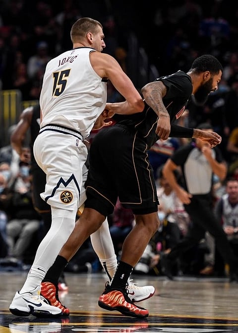PHOTOGRAPH COURTESY OF NBA
NIKOLA Jokic of the Denver Nuggets shoves former Miami Heat forward Markieff Morris from behind during a regular season game in 2021-2022 season.