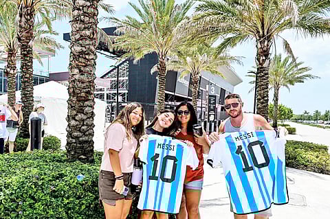 CHANDAN KHANNA/AGENCE FRANCE-PRESSE
FANS of Lionel Messi pose for a photo while waiting for his arrival at the DRV PNK Stadium in Fort Lauderdale, Florida.