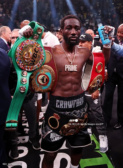TERENCE Crawford celebrates with his championship belts after defeating Errol Spence in their welterweight title showdown at the T-Mobile Arena in Las Vegas. | AL BELLO/AGENCE FRANCE-PRESSE