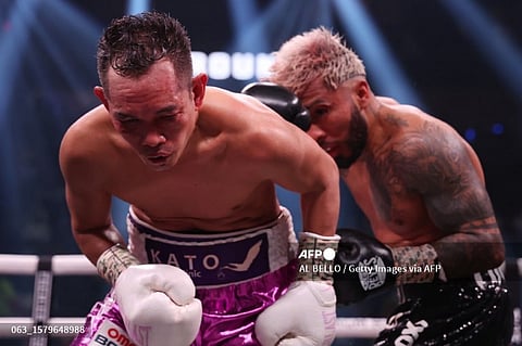 LAS VEGAS, NEVADA - JULY 29: Nonito Donaire reacts after being punched by Alexandro Santiago during the WBC World Bantamweight Championship bout at T-Mobile Arena on July 29, 2023 in Las Vegas, Nevada. Santiago defeated Donaire in twelve rounds by unanimous decision. Al Bello/Getty Images/AFP (Photo by AL BELLO / GETTY IMAGES NORTH AMERICA / Getty Images via AFP)