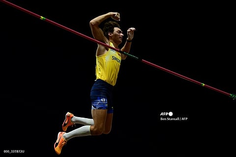 Sweden's Armand Duplantis clears the bar as he competes in the men's pole vault final during the World Athletics Championships at the National Athletics Centre in Budapest on 26 August. Photo by Ben Stansall / AFP