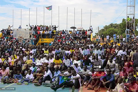 South Sudanese basketball supporters gather to watch a live broadcast of the FIBA Basketball World Cup group B match between Serbia and South Sudan, at Nimra Talata Basketball Stadium in Juba on August 30, 2023. The FIBA Basketball World Cup 2023 takes place in the Philippines, Japan, and Indonesia from August 25, 2023 to September 10, 2023. (Photo by Peter Louis GUME / AFP)