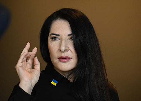FILE PHOTO: Serbian artist Marina Abramovic poses for the media after a news conference on her latest work titled "7 Deaths of Maria Callas" at the Deutsche Oper opera house in Berlin, Germany, on 6 April 2022. (Photo by Tobias SCHWARZ / AFP)