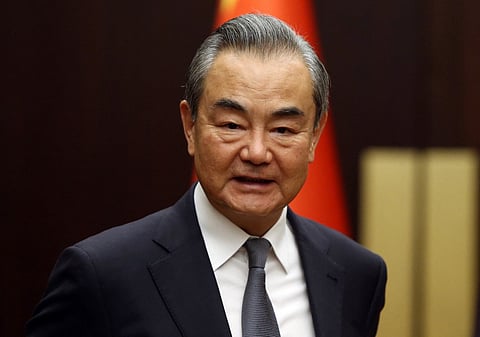 FILE PHOTO: China's Foreign Minister Wang Yi (Photo by POOL / AFP)