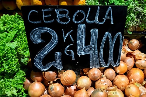 Onions are seen for sale at the Central Market in Buenos Aires, on 12 August 2023. The National Institute of Statistics and Census (Indec) released July 2023 inflation, which reached 6.3% and accelerated again after the drop in June. In the last 12 months, the figure has marked a decrease since it reached 113.4%. (Photo by LUIS ROBAYO / AFP)