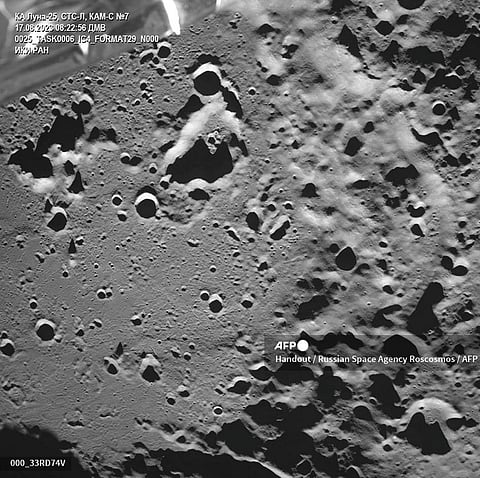 This handout photograph taken by the Luna-25 rover (Moon-25) and released by Russian Space Agency Roscosmos on 17 August 2023 shows the Zeeman lunar impact crater on the far side of the Moon. (Photo by Handout / Russian Space Agency Roscosmos / AFP)