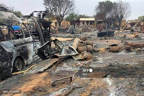 This picture shows a view of destruction in a livestock market area in al-Fasher, the capital of Sudan's North Darfur state.(Photo by AFP)