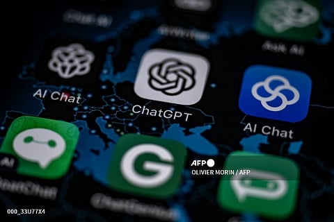 FILE PHOTO: This illustration picture shows the AI (Artificial Intelligence) smartphone app ChatGPT surrounded by other AI apps. (Photo by OLIVIER MORIN / AFP)