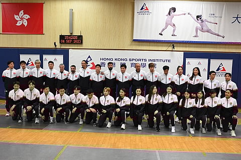 Members of the Hong Kong fencing team pose during a media event in Hong Kong on 4 September 2023, ahead of the Asian Games to be held in Hangzhou, China from September 23 to October 8. (Photo by Peter PARKS / AFP)