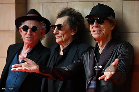 (L-R) Keith Richards, Ron Wood and Mick Jagger of legendary British rock band, The Rolling Stones pose as they arrive to attend a launch event for their new album, "Hackney Diamonds" at Hackney Empire in London on September 6, 2023, their first album of original material since 2005. The Rolling Stones will on Wednesday, September 6, reveal details of "Hackney Diamonds", the band's first studio album of new music since 2005, at a launch event in east London. (Photo by Daniel LEAL / AFP)