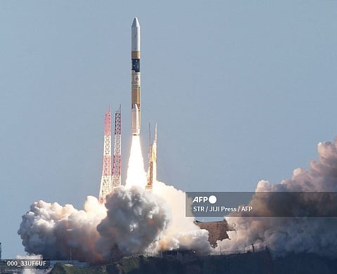 An H2-A rocket carrying a small lunar surface probe and other objects lifts off from the Tanegashima Space Centre on Tanegashima island, Kagoshima prefecture. (Photo by JIJI Press / AFP)