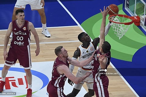 Dennis Schroder and Germany soar past Latvia, 81-79, in their FIBA World Cup quarterfinal game Wednesday. Photo by JAM STA ROSA / AFP