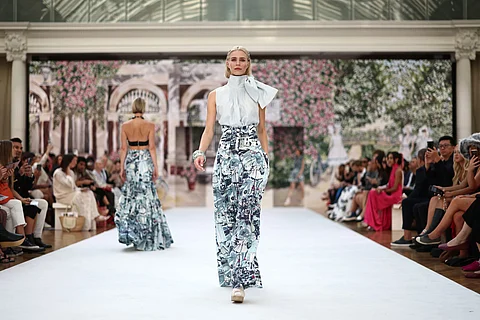 A model presents a creation by Irish designer Paul Costelloe during a catwalk presentation for his Spring/Summer 2024 collection (SS24) during London Fashion Week in London on 15 September 2023. (Photo by HENRY NICHOLLS / AFP)