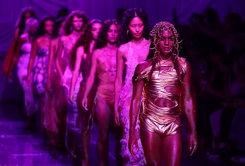 Models present creations by Greek designer Dimitra Petsa during a catwalk presentation for her Di PETSA Spring/Summer 2024 collection, during London Fashion Week in London, on 15 September 2023. (Photo by HENRY NICHOLLS / AFP)