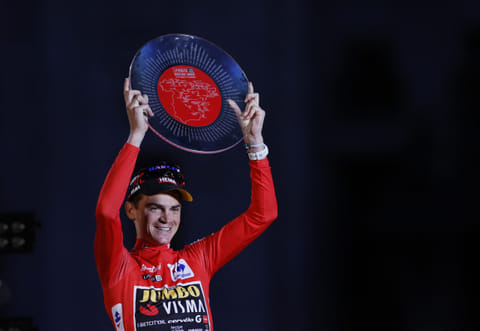 Overall leader Team Jumbo-Visma's US rider Sepp Kuss (C) celebrates on the podium after winning the 2023 La Vuelta cycling tour of Spain, in Madrid, on 17 September 2023. (Photo by Oscar DEL POZO / AFP)