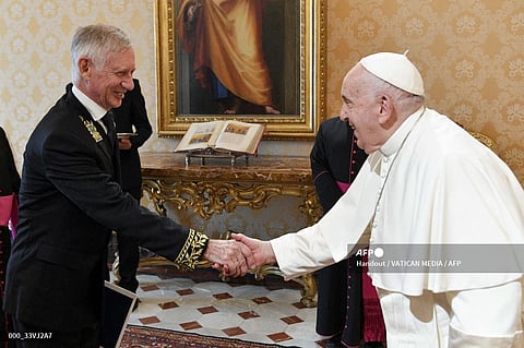 This photo taken and handout on September 18, 2023 by The Vatican Media shows Pope Francis welcoming Ivan Soltanovsky, Russian ambassador to the Holy See on the occasion of the presentation of his Credential Letters to the Pope in The Vatican. (Photo by Handout / VATICAN MEDIA / AFP)