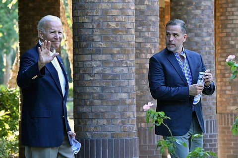 FILE PHOTO: US President Joe Biden (L) waves alongside his son Hunter Biden after attending mass at Holy Spirit Catholic Church in Johns Island, South Carolina, on August 13, 2022. (Photo by Nicholas Kamm / AFP)