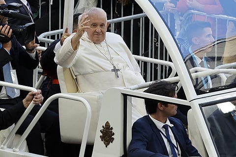 Pope Francis waves as he arrives to celebrate mass at the Velodrome stadium, in the southern port city of Marseille on September 23, 2023. The first pope in 500 years to visit the city of Marseille, Pope Francis is on a two-day visit for the concluding session of the Mediterranean Meetings, a Church-led initiative aiming to build community amongst the regions various peoples, religions, and cultures. (Photo by AFP)