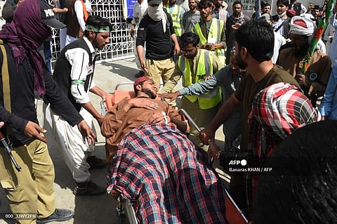 Volunteers shift a blast victim on a stretcher at a hospital in Quetta on September 29, 2023, after a suicide bomber targeted a procession marking the birthday of Islam's Prophet Mohammed in Mastung district. At least 25 people were killed and dozens more wounded on September 29 by a suicide bomber targeting a procession marking the birthday of Islam's Prophet Mohammed in Pakistan's southwestern Balochistan province. (Photo by Banaras KHAN / AFP)