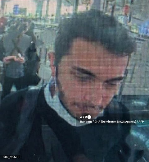 FILE PHOTO: A screen grab made from a CCTV released by Demiroren News Agency on 22 April 2021 shows Thodex founder Faruk Fatih Ozer on passport control at Istanbul international airport. (Photo by Handout / DHA (Demiroren News Agency)