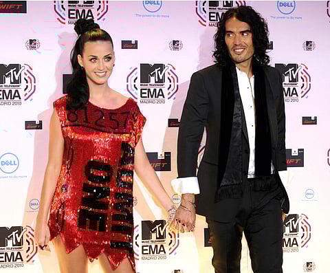 FILE: US singer Katy Perry poses with her husband, British comic Russel Brand on the red carpet on 7 November 2010 prior the 2010 MTV Europe Music MTV (EMA) host in Madrid.AFP PHOTO/ DOMINIQUE FAGET.