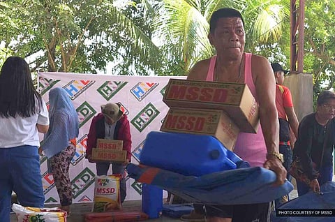 Families affected by the recent fire incident at Brgy. Rosary Heights-7 in Cotabato City get relief assistance from the Ministry of Social Services and Development (MSSD) and the Office of Member of Parliament Hashemi Dilangalen on September 8, 2023. (Photo courtesy of MSSD)
